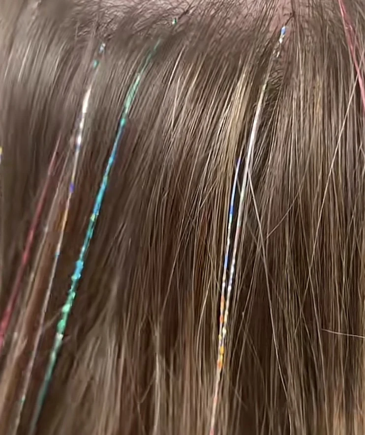 Close-up of aqua and iridescent tinsel accents