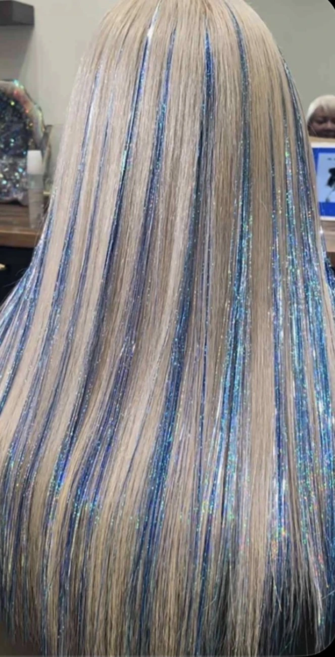 Blue and silver tinsel through blonde hair