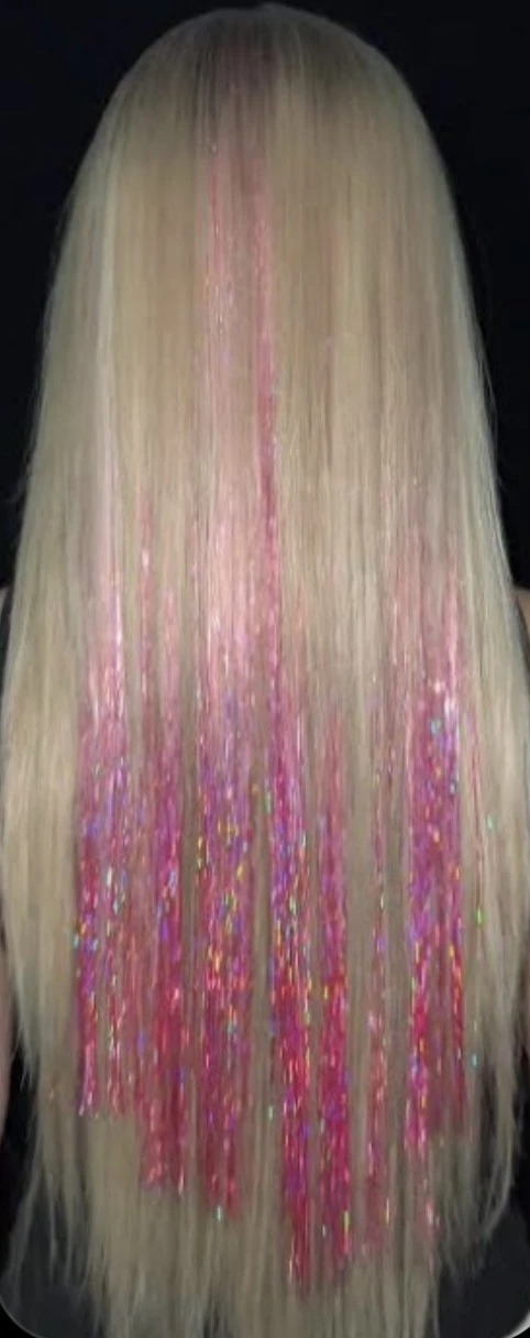 Pink tinsel sparkling through blonde hair